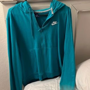 Nike size large zip up hooded jacket. Teal color